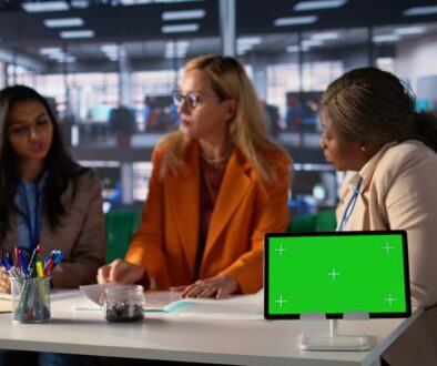 Group of businesswomen sharing insight on a new project next to copy space